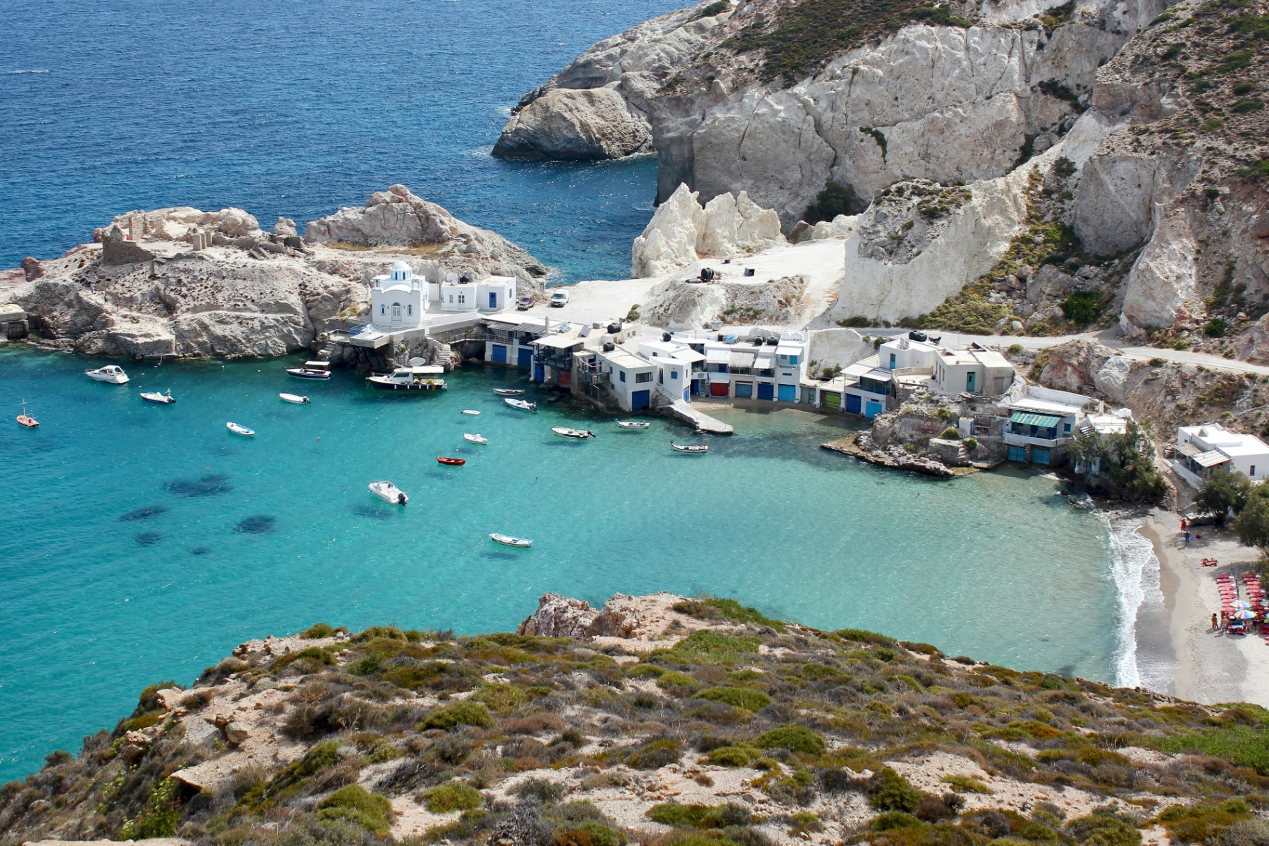 Greek Islands - turquoise waters and white coastal buildings
