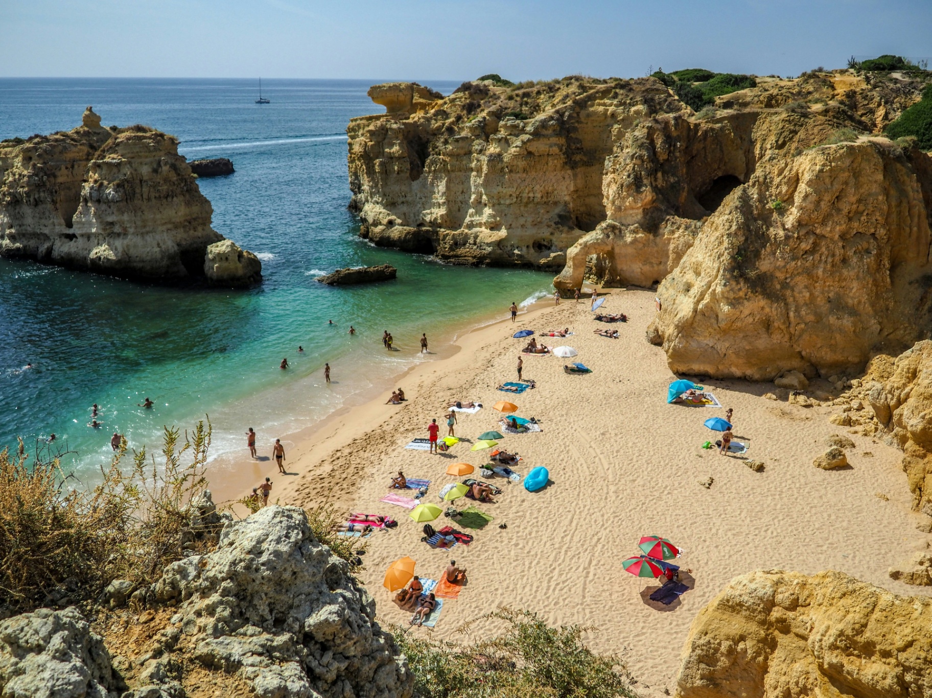 Beautiful beach cove on Portugal's Algarve coast with turquoise waters and golden cliffs